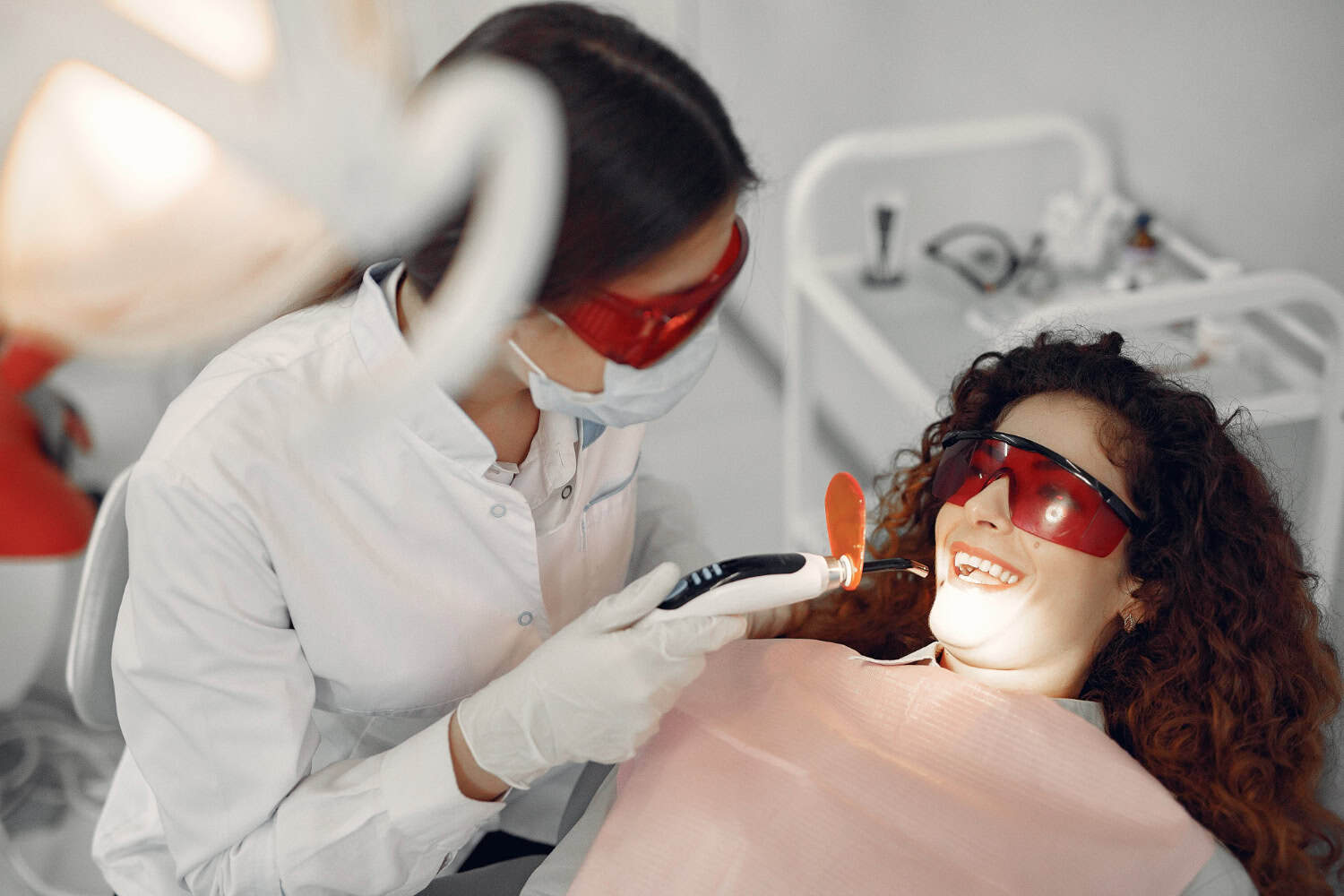 Dentist performing in-office teeth whitening in Westford for safe, effective, and lasting smile enhancement.